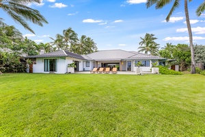 View from the back of the estate, where garden, lawn, and sea converge in quiet elegance.