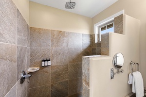 Rainfall shower in the guest suite bath offers a spa-like retreat after beach or golf adventures.