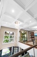 Vaulted ceiling and chandelier add drama to common space.
