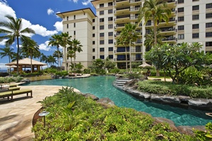 The main lagoon pool surrounded by palm trees outside Ko Olina Beach Villas O1402.