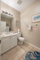 Step into your bright bathroom with coastal charm, featuring fresh towels and thoughtful touches for your comfort.