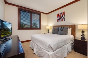 Rest easy in your comfortable bedroom featuring warm wood accents, soft linens, and thoughtful touches that make you feel right at home.