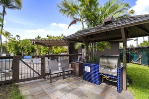Fire up the grill and savor outdoor cooking in this tropical BBQ pavilion, where palm trees sway overhead and poolside memories are made.