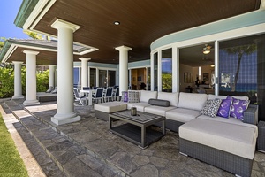 Cozy lanai seating area perfect for morning coffee or poolside supervision.