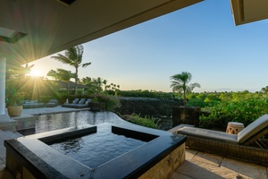 Infinity pool and hot tub with breathtaking sunset views and the surrounding landscape.