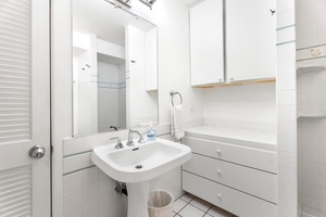 Full second bathroom with vanity and easy hallway access.