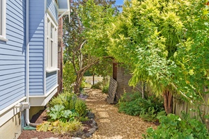 Outside, the private backyard offers bike storage.