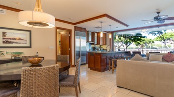 The incredible kitchen featuring stainless steel appliances and bar seating.