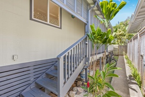 Side entrance with charming landscaping and easy access to both the front and back of the property.