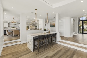 Gourmet kitchen with marble counters, stainless steel appliances, and everything needed for chef-inspired meals.