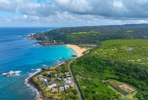 Aerial shot showcasing the pristine beaches and lush landscapes nearby.
