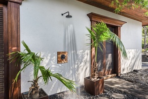 Refresh under your private outdoor shower surrounded by tropical palms and natural beauty.