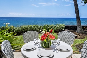 Dine al fresco on the shaded lanai, where ocean breezes and crashing waves set the perfect island mood.