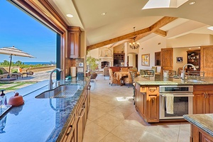 Spacious kitchen opens up to the patio and BBQ area