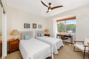 Guest room with XL twin beds, and bright garden views. A workspace window nook provides a desk and a lovely view out over the treetops.