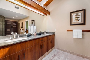 The spacious ensuite features dual vanities, generous storage, and room to settle in comfortably.