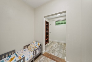 Bonus nursery nook with a toddler bed and access to walk-in storage—perfect for young families.