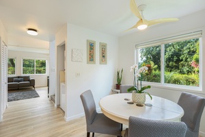 Open dining area flows easily into the living space, with garden views from every window.