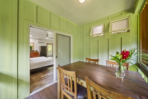 Studio suite interior with private dining and king-size bed—perfect for grandparents or couples seeking privacy.