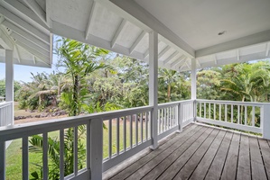 Step outside onto the shaded wraparound lanai, where lush tropical greenery surrounds you. The perfect spot for morning coffee or quiet moments in nature.