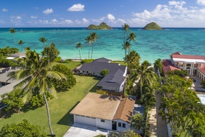 Aerial view of the oceanfront estate showcasing expansive beachfront grounds, swaying palms, and a premier location along Lanikai’s world-famous shoreline.
