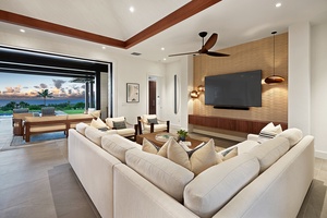 A bright and airy living room with plush seating, perfect for relaxing after a day of adventure.