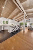 The oversized kitchen island offers plenty of space for meals, snacks, and conversation.