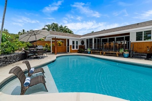 Lounge poolside in the shade of the umbrella while the water does the rest.