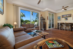 A well-lit and inviting living space designed for relaxation and comfort.