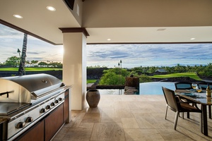 Grill poolside at the built-in barbecue and dine al fresco with panoramic fairway and sunset views.