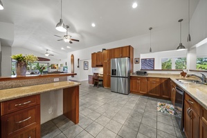 Kitchen-to-living flow with large island and easy access to outdoor spaces.