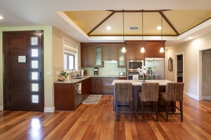 This gourmet kitchen combines beauty and function, with wood cabinetry and open sight lines for easy entertaining.