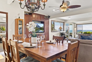 Dining area at Hale Oka Nunu with seating for six and ocean views.