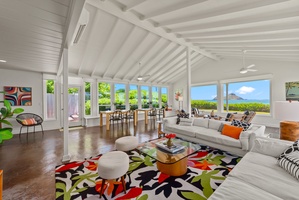 Gather with loved ones in this open-concept space steps from the sea.