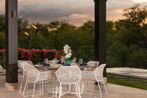 Share meals with family and friends surrounded by lush greenery and open skies.