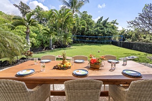 Outdoor dining setup amidst a private garden, ideal for al fresco meals with family or friends.