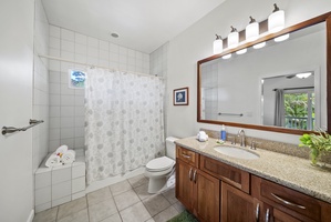 The ensuite bathroom includes a full vanity, shower/tub combo, and thoughtful amenities, making mornings easy and comfortable for every guest.