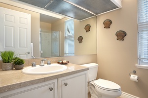 The upstairs bedroom bathroom features elegant fixtures and a bright, airy design for a refreshing morning routine.