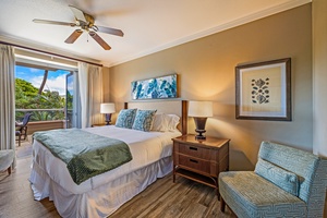 The primary suite at Honua Kai Konea 232 offers a plush bed and serene ambiance for restful nights.