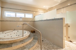 Experience relaxation in the jacuzzi tub in the third bathroom