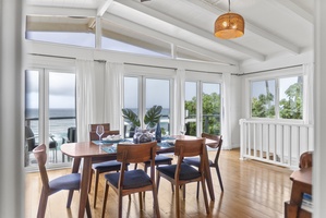 Open dining area that flows seamlessly to the deck, letting you enjoy meals with refreshing trade winds and panoramic coastal scenery.