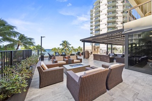 Lounge in comfort on the rooftop terrace, featuring cozy seating and ocean breezes.