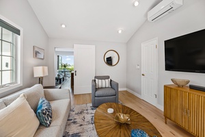 Downstairs family room with King size sofa bed and TV.