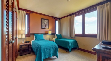 The third bedroom has extra long twin beds for a restful stay.