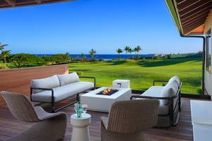 Outdoor living space with panoramic fairway and ocean views.