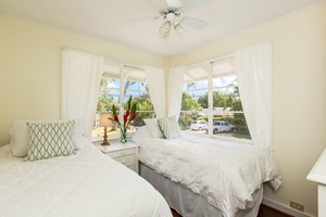 The second bedroom in the main house offers twin beds, convertible to a king upon request.
