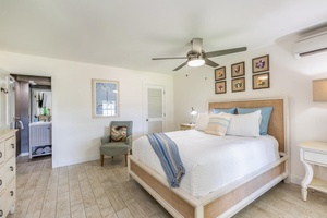 Recharge in the bright guest bedroom featuring a queen bed and an ensuite bathroom.