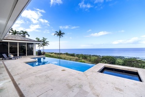Your private pool deck offers breathtaking ocean views framed by swaying palms and endless blue skies.