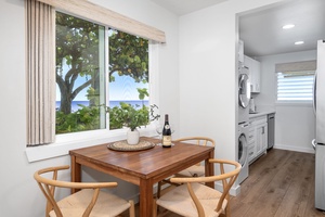 Cozy corner dining nook with ocean views—perfect for morning coffee or a sunset dinner.