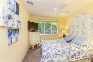 Comfortable accommodations with a queen bed and TV for private downtime.